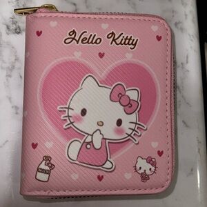 Hello kitty wallet in perfect condition

Sanrio
